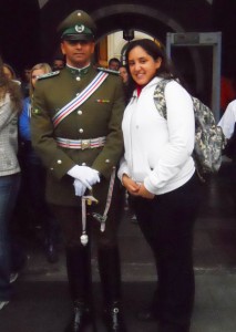 Natalie Nazar next to a guard at La Moneda in Santiago, Chile during her 2010 study abroad trip