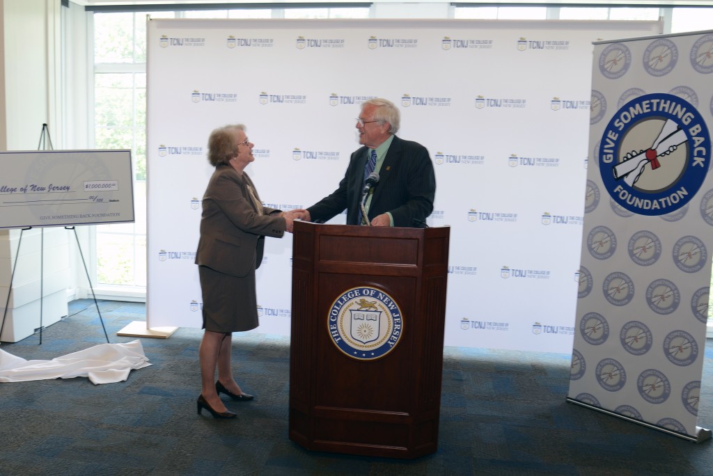 President Gitenstein accepts a check for $1 million from Robert Carr