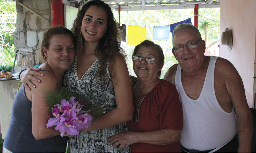 Galindo (second from left) met her great aunt and uncle, Isolina and Roberto (right), and (far left) their daughter, Bettis. Photo by Matt Furman