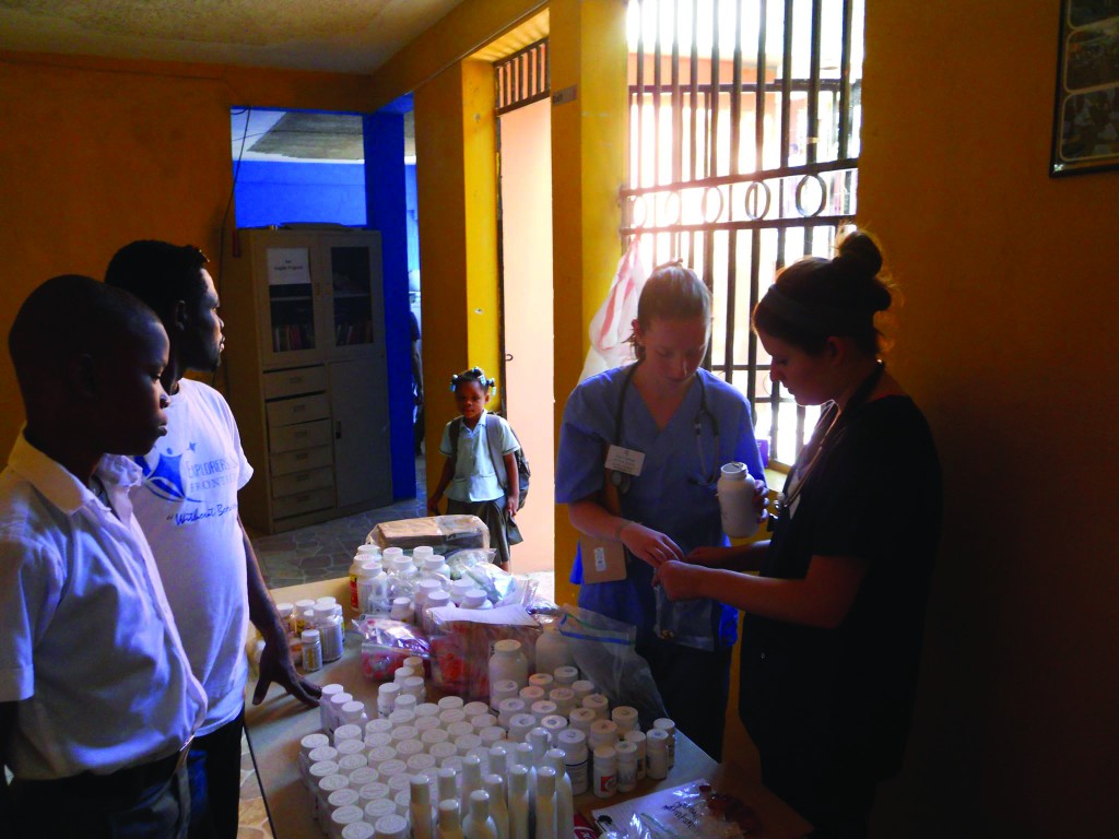 TCNJ students fill prescriptions in a pop-up clinic pharmacy. 