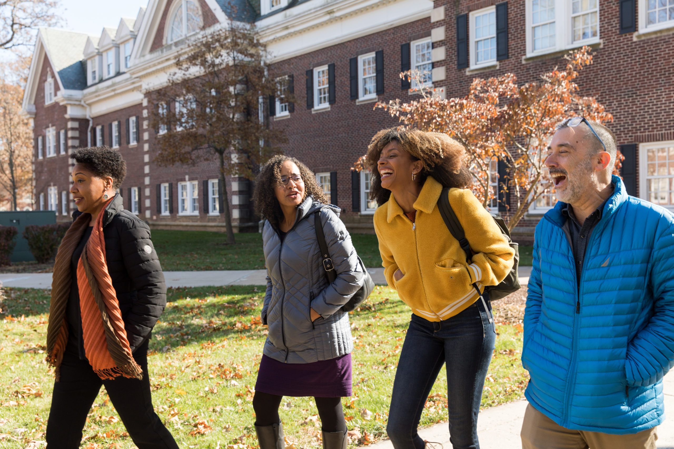 Professors Cassandra Jackson, Winnifred Brown-Glaude, Juda Bennett, and Piper Williams walk to Kendall Hall before their Skype call with Roxane Gay.