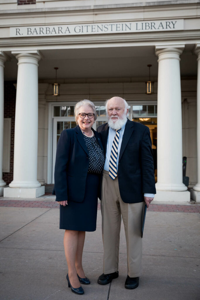 Barbara Gitenstein and Donald Hart stand in front of the R. Barbara Gitenstein Library