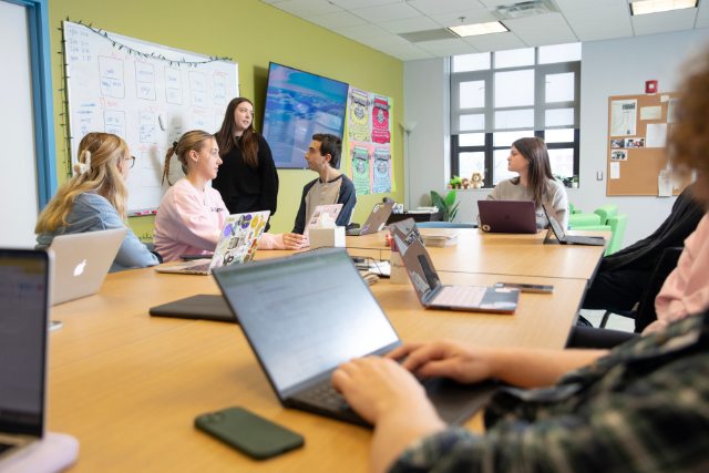 students collaborating in a classroom setting